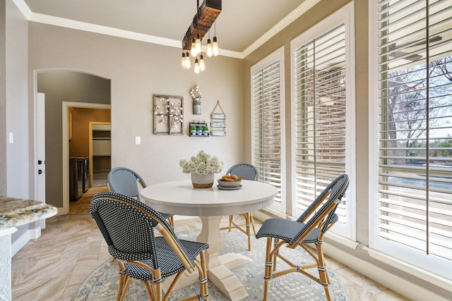 dining area with ornamental molding