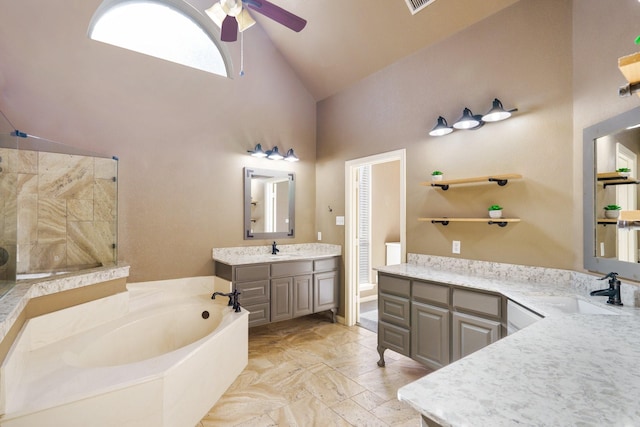 bathroom featuring vanity, high vaulted ceiling, ceiling fan, and a bathing tub