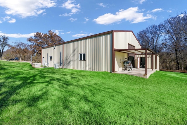 view of outdoor structure with a yard and cooling unit