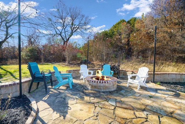 view of patio / terrace featuring a fire pit