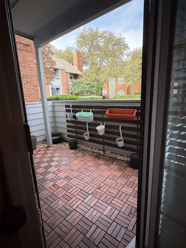 view of patio featuring a balcony