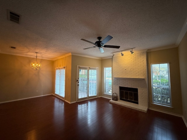 unfurnished living room with crown molding, dark hardwood / wood-style floors, and a brick fireplace