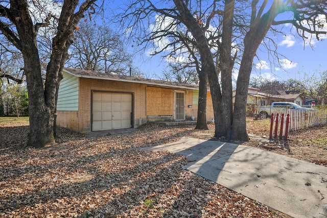 ranch-style home featuring a garage