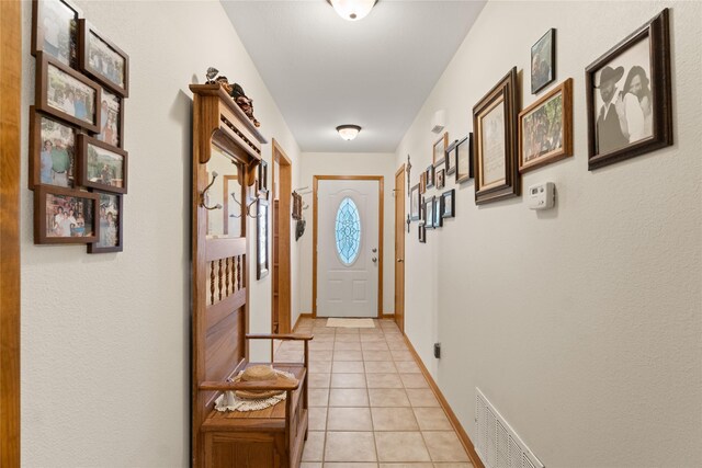 doorway to outside featuring light tile patterned floors