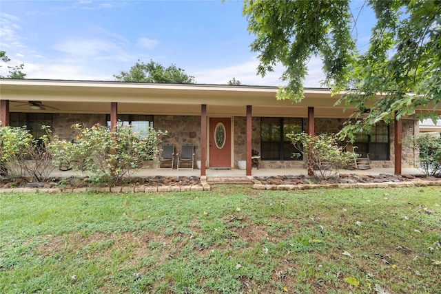 ranch-style home with a patio and a front lawn