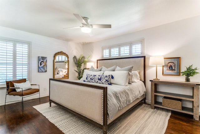 bedroom with dark wood-type flooring and ceiling fan