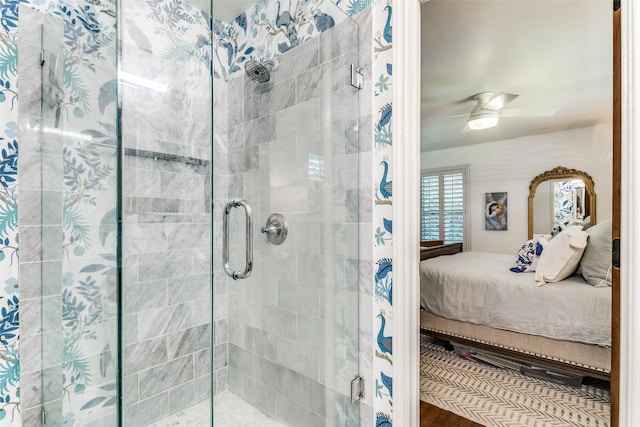 bathroom featuring ceiling fan and a shower with door