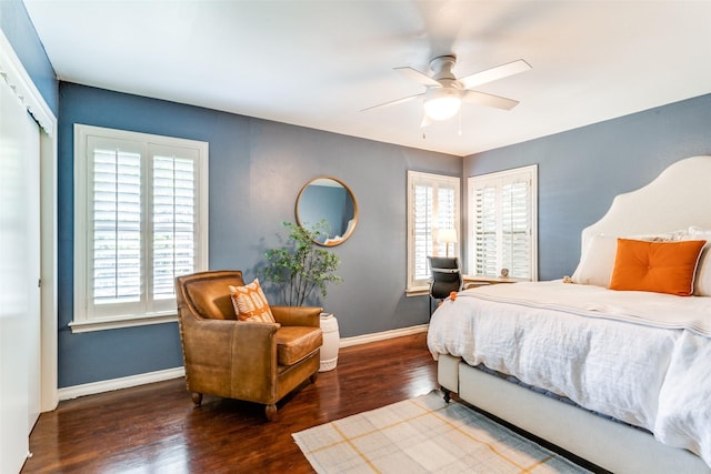 bedroom with a closet, ceiling fan, and dark wood-type flooring