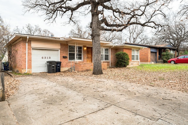 ranch-style house featuring a garage