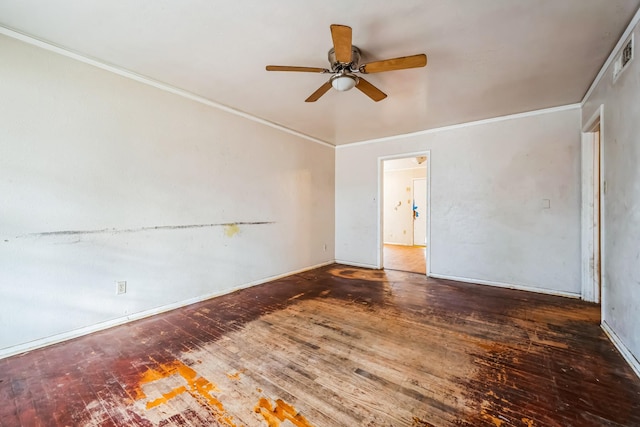 spare room featuring crown molding, ceiling fan, and dark wood-type flooring