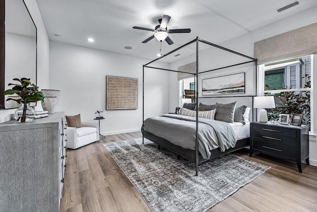 bedroom with ceiling fan and hardwood / wood-style floors