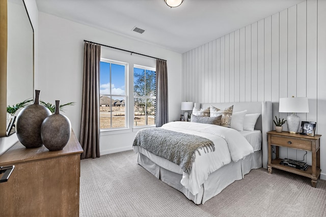 bedroom featuring light colored carpet