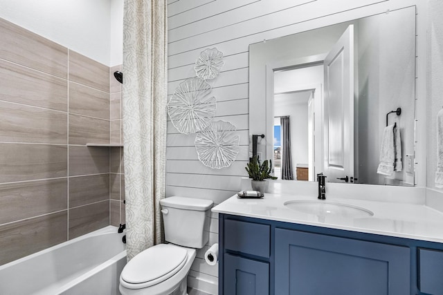 full bathroom with shower / bath combination with curtain, vanity, toilet, and wood walls