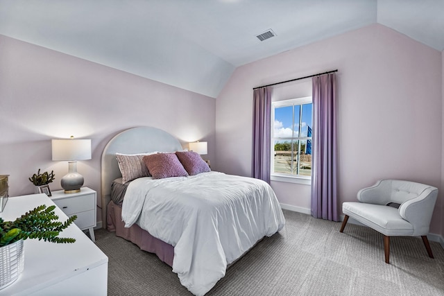 carpeted bedroom featuring vaulted ceiling