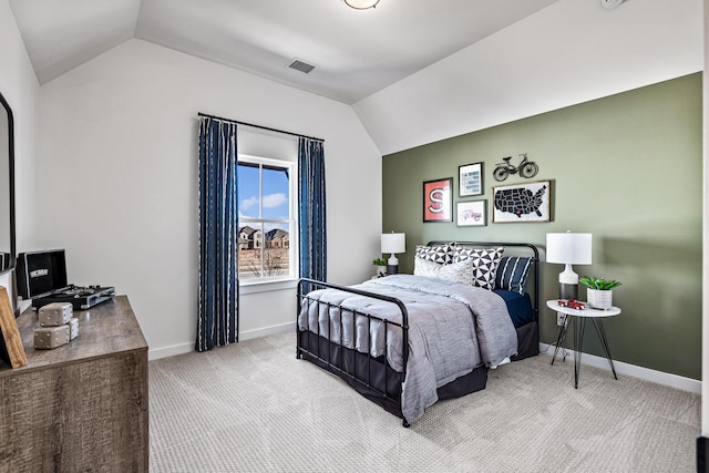 carpeted bedroom featuring lofted ceiling