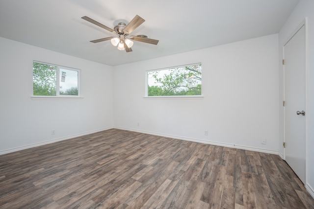 unfurnished room featuring ceiling fan and dark hardwood / wood-style flooring