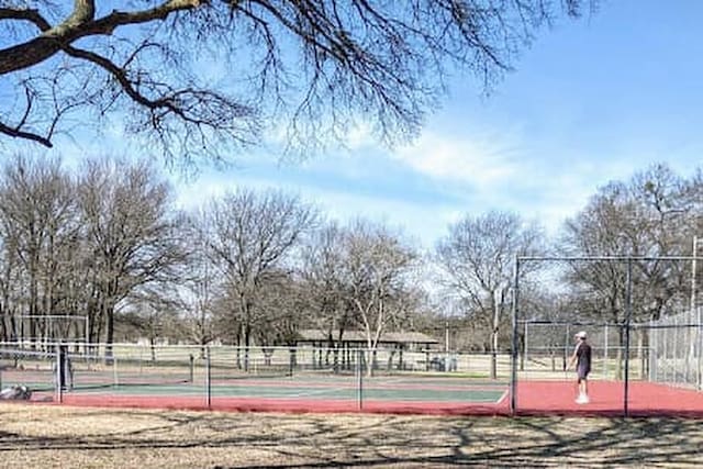 view of basketball court featuring tennis court