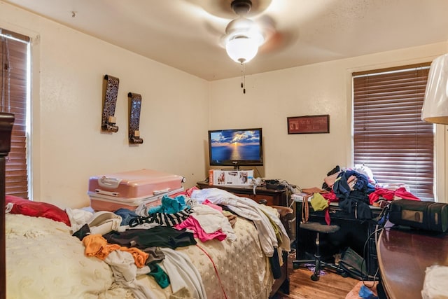 bedroom featuring hardwood / wood-style flooring and ceiling fan