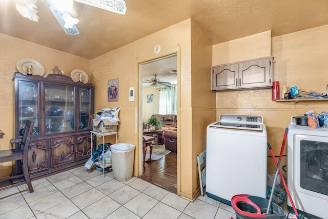 laundry room with washer and dryer, light tile patterned floors, and ceiling fan