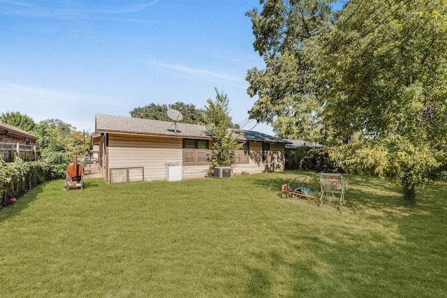 view of yard with central AC