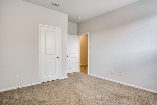 unfurnished bedroom featuring carpet