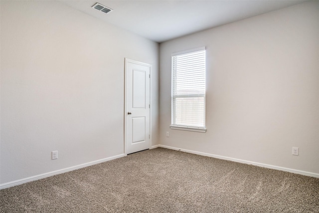 unfurnished room with carpet floors