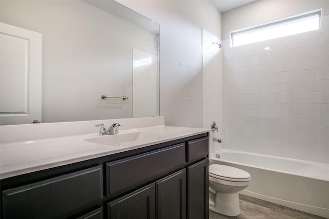 full bathroom featuring shower / tub combination, toilet, vanity, and hardwood / wood-style flooring