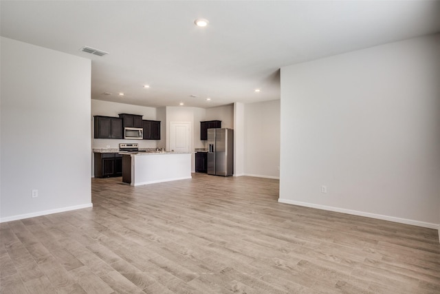 unfurnished living room with light hardwood / wood-style flooring