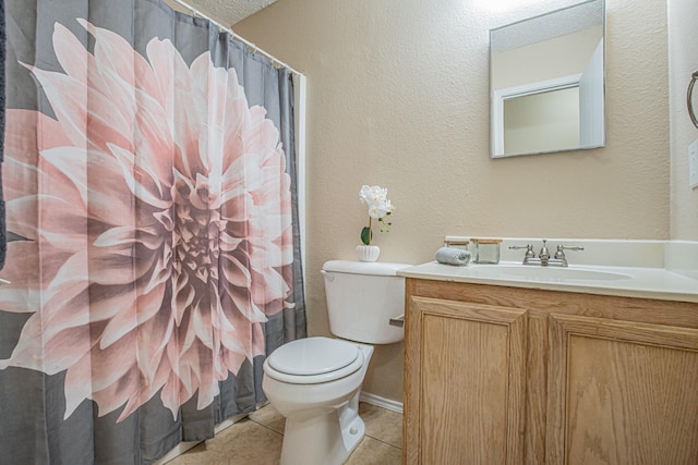 bathroom with tile patterned flooring, a shower with curtain, vanity, and toilet