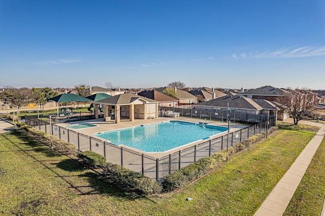 view of pool featuring a yard