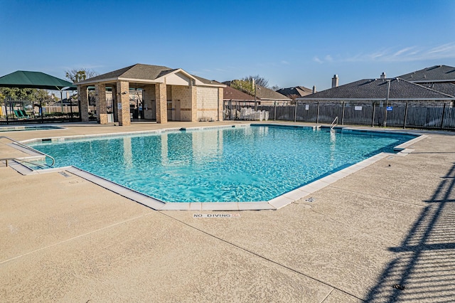 view of swimming pool featuring a patio