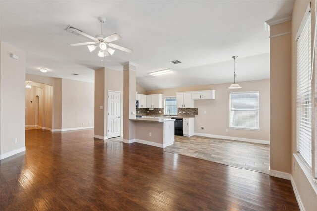 unfurnished living room with vaulted ceiling, ceiling fan, and dark hardwood / wood-style flooring