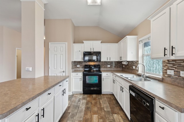 kitchen with vaulted ceiling, sink, dark wood-type flooring, white cabinets, and black appliances