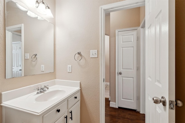 bathroom featuring vanity and hardwood / wood-style flooring