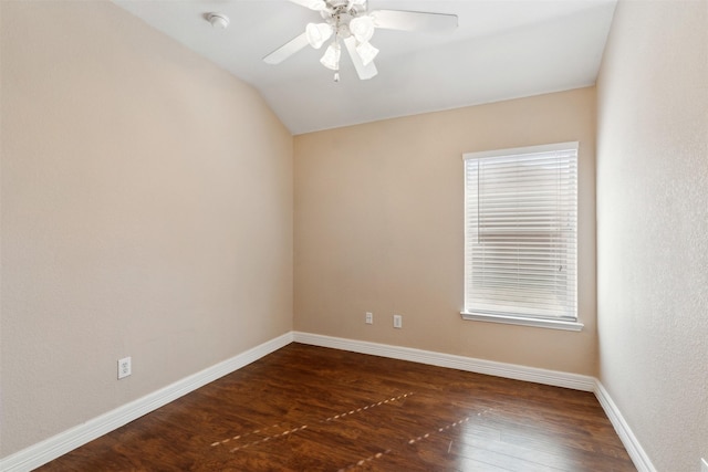 unfurnished room with ceiling fan, a healthy amount of sunlight, dark hardwood / wood-style floors, and lofted ceiling