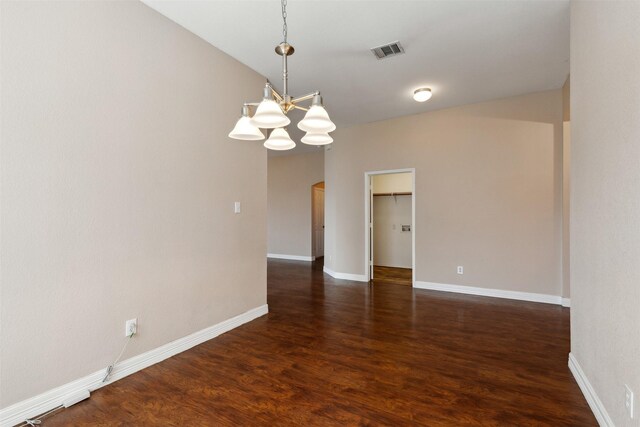 unfurnished living room with ceiling fan, dark hardwood / wood-style floors, and a wealth of natural light