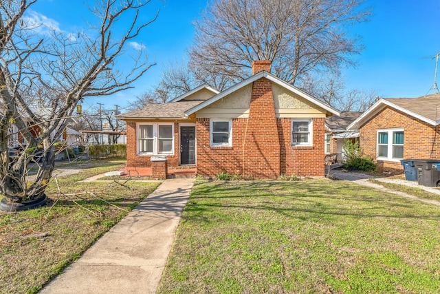 bungalow with a front yard