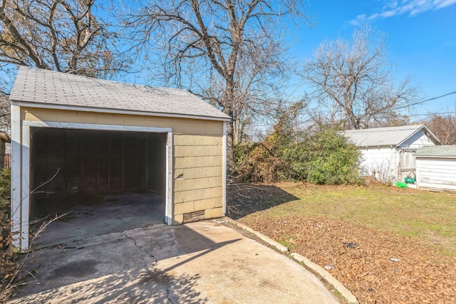 garage featuring a yard