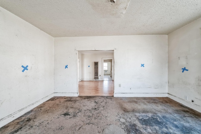 empty room with a textured ceiling