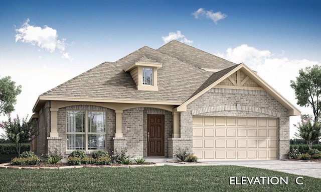 view of front of home with a garage and a front lawn