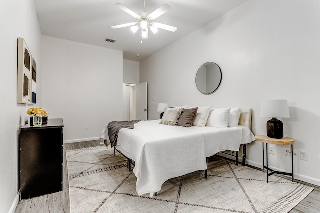 bedroom featuring wood-type flooring and ceiling fan