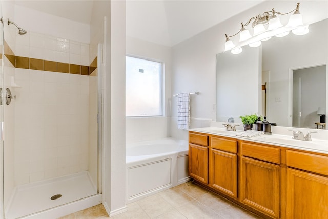 bathroom featuring tile patterned floors, vanity, and plus walk in shower