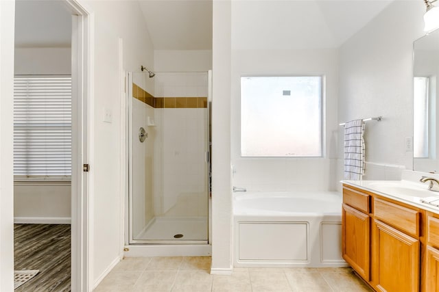 bathroom featuring separate shower and tub, tile patterned floors, and vanity