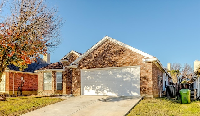 view of property with a front yard and a garage