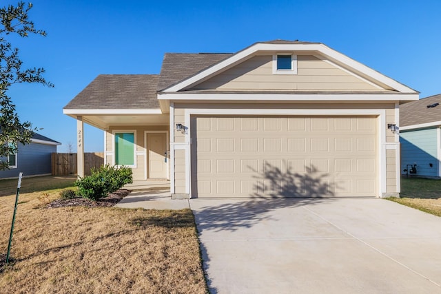 ranch-style home featuring a garage and a front yard