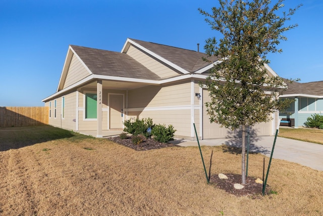 exterior space featuring a garage and a front lawn