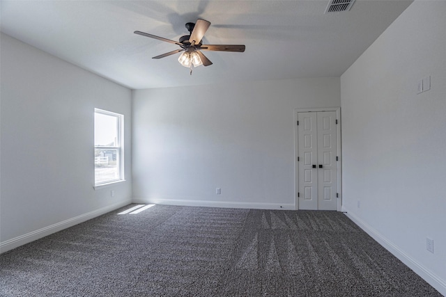 spare room with ceiling fan and carpet floors