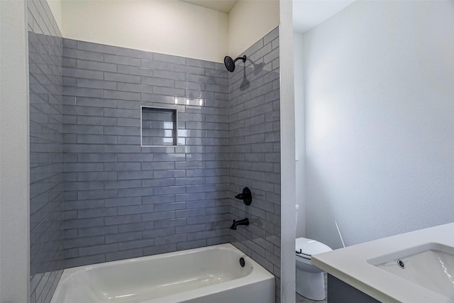 full bathroom with sink, toilet, and tiled shower / bath