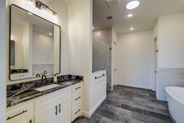 bathroom with vanity and plus walk in shower