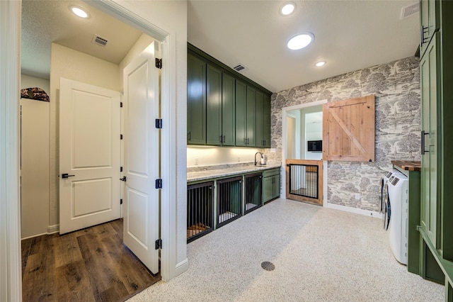 kitchen with sink and green cabinets